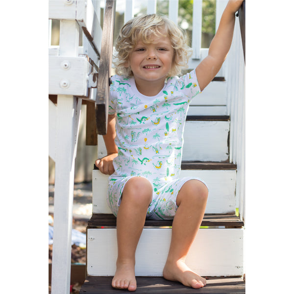 Boys Pajamas alliogagors on holiday sunny day summer playground sitting