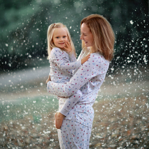 Softest pajamas ski resort print for the whole family. Matching Christmas pajamas pjs vacation skiing snow boots close-up details women mom daughter gift soft warm Petidoux
