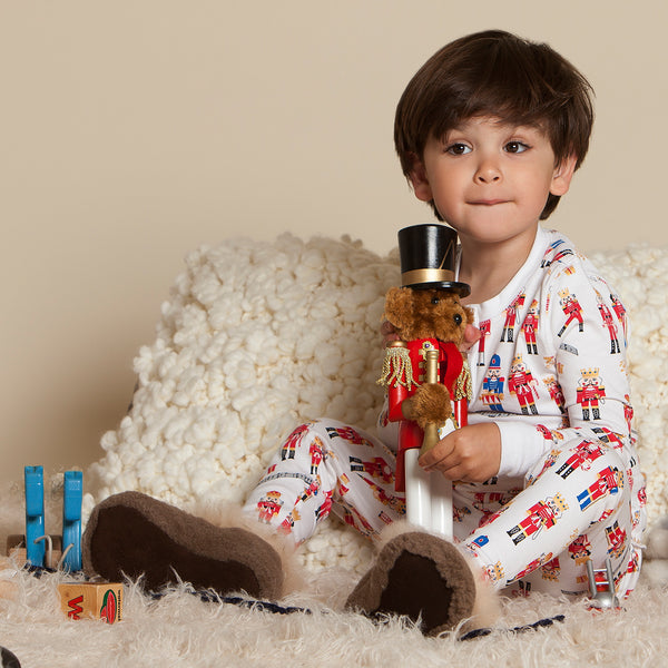 toddler boy wearing brown baby alpaca wool slippers